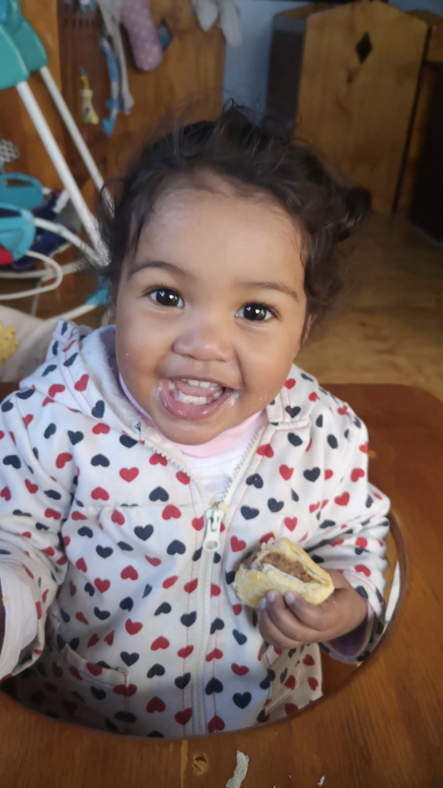 Happy toddler enjoying a snack