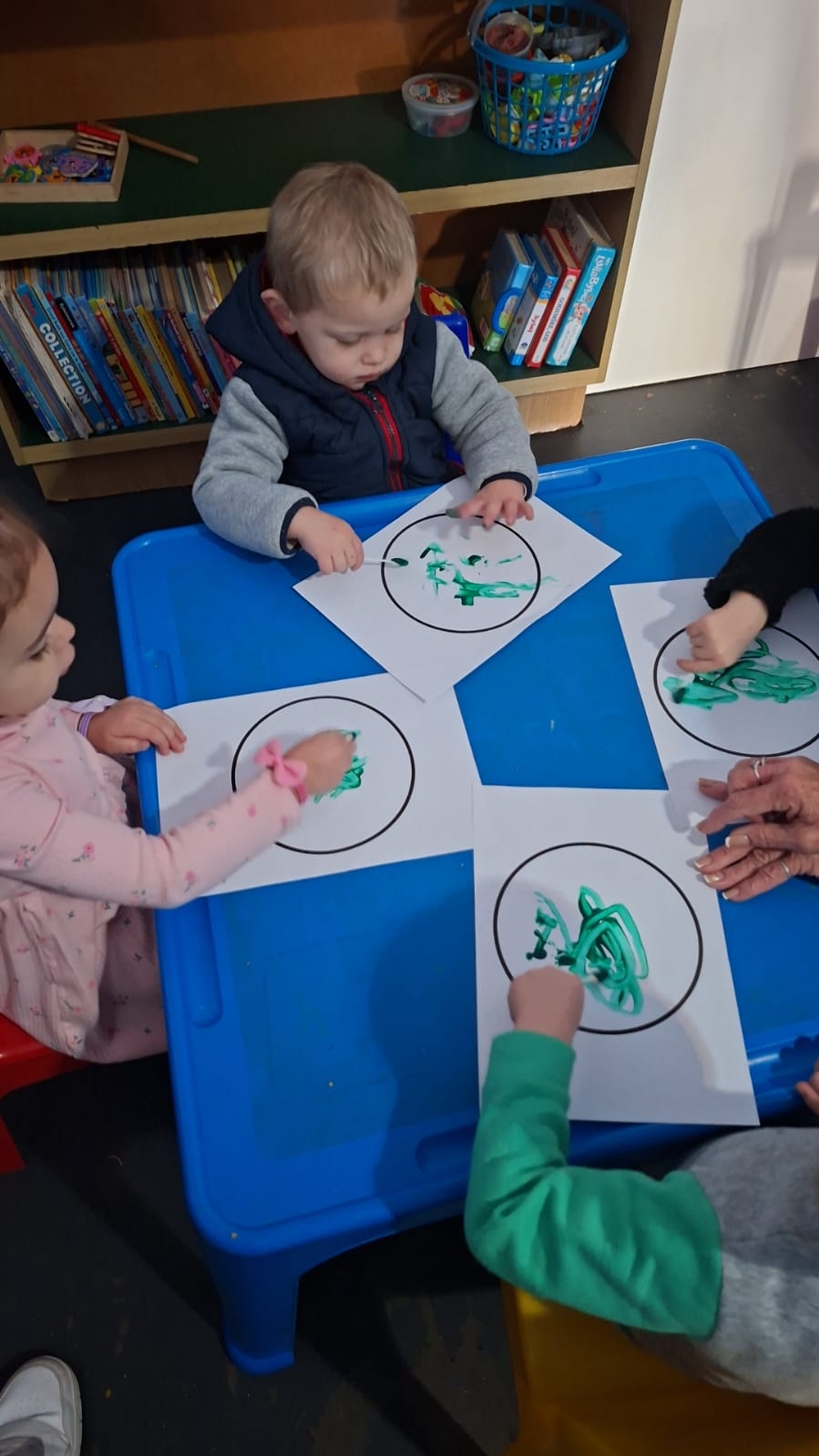 Toddlers finger painting