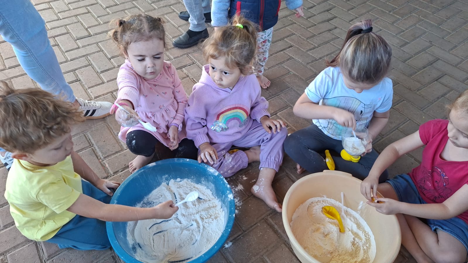 Children playing with sensory flour